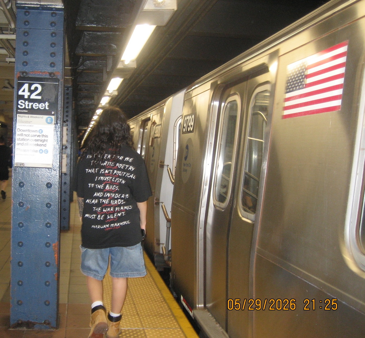 Mell waiting underground for a train.